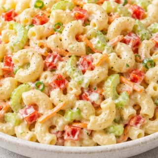 Creamy Dreamy Macaroni Salad: Ultimate Crowd-Pleaser! Make the ultimate Macaroni Salad! This creamy, tangy recipe is packed with fresh veggies and is perfect fo