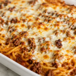 Million Dollar Baked Spaghetti - Baked spaghetti: master this hearty casserole with rich meat sauce and creamy cheese layers. Perfect for a satisfying family di