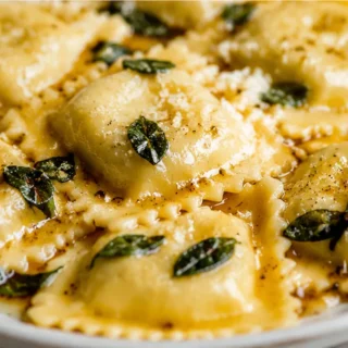 Butternut Squash Ravioli with Sage Butter - butternut ravioli - Butternut ravioli: craft these incredible homemade pasta pillows with a rich cheese filling and