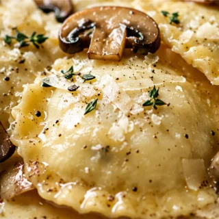 Melt-in-Your-Mouth Mushroom Ravioli - Mushroom ravioli: master homemade cheesy mushroom ravioli drenched in a savory rosemary butter sauce. A comforting and imp