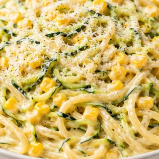 Creamy Zucchini Pasta Dream! Zucchini pasta: make this creamy, flavorful dish in under 30 minutes. Features a velvety zucchini sauce with sweet corn. Perfect we
