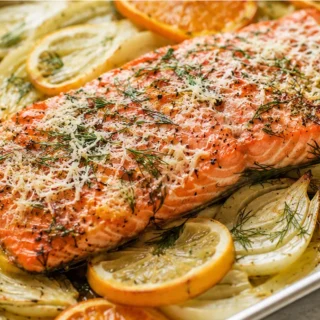 Slow-Roasted Citrus Salmon with Fennel - Citrus salmon: savor this elegant, slow-roasted dish with tender fennel and sharp Parmesan. A perfect meal, easy enough