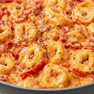 Creamy Roasted Red Pepper Tortellini: Your New Obsession! Red pepper tortellini: master this creamy, smoky pasta dish in under 30 minutes. Features tender torte