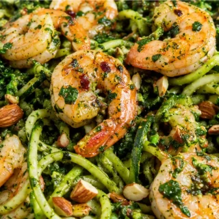 15-Min Spicy Shrimp & Pesto Zoodles - Spicy shrimp: cook this quick and bright dish with fresh pesto zoodles. Ready in just 15 minutes, it's perfect for a healt